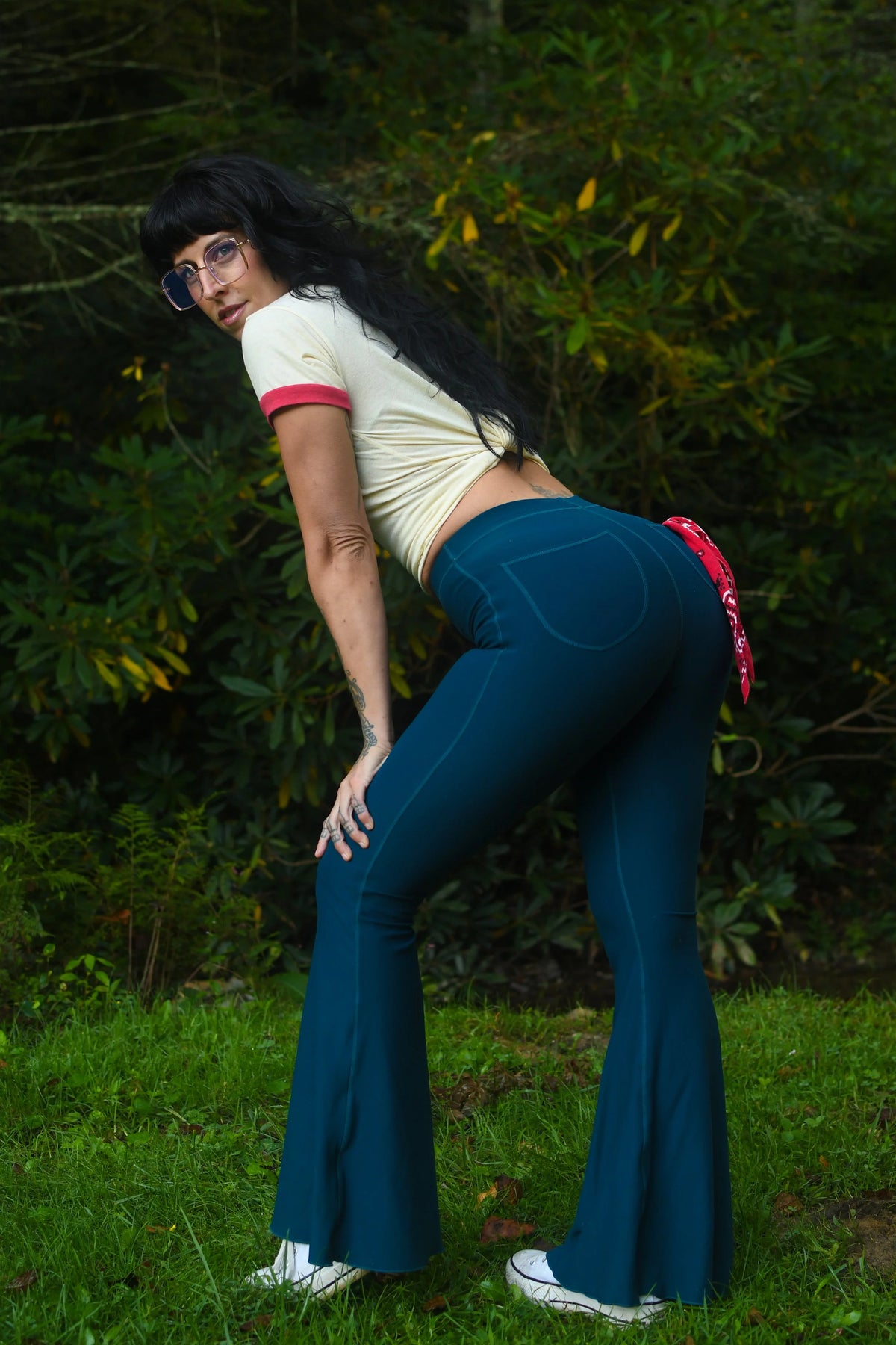 Women’s high waisted blue flared pants with dramatic bell bottom legs
